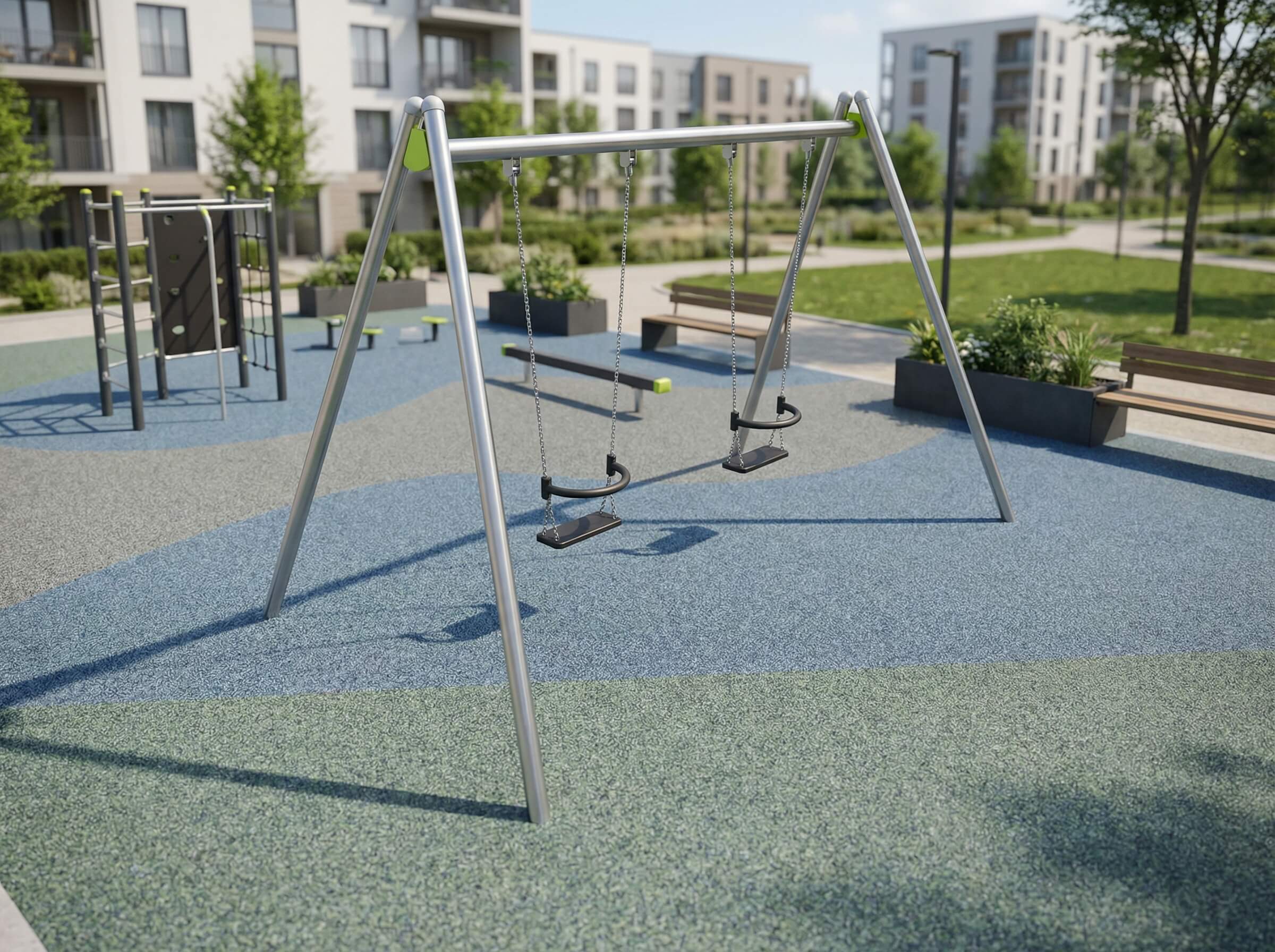 Modern playground with swings on colorful surfacing near residential buildings.