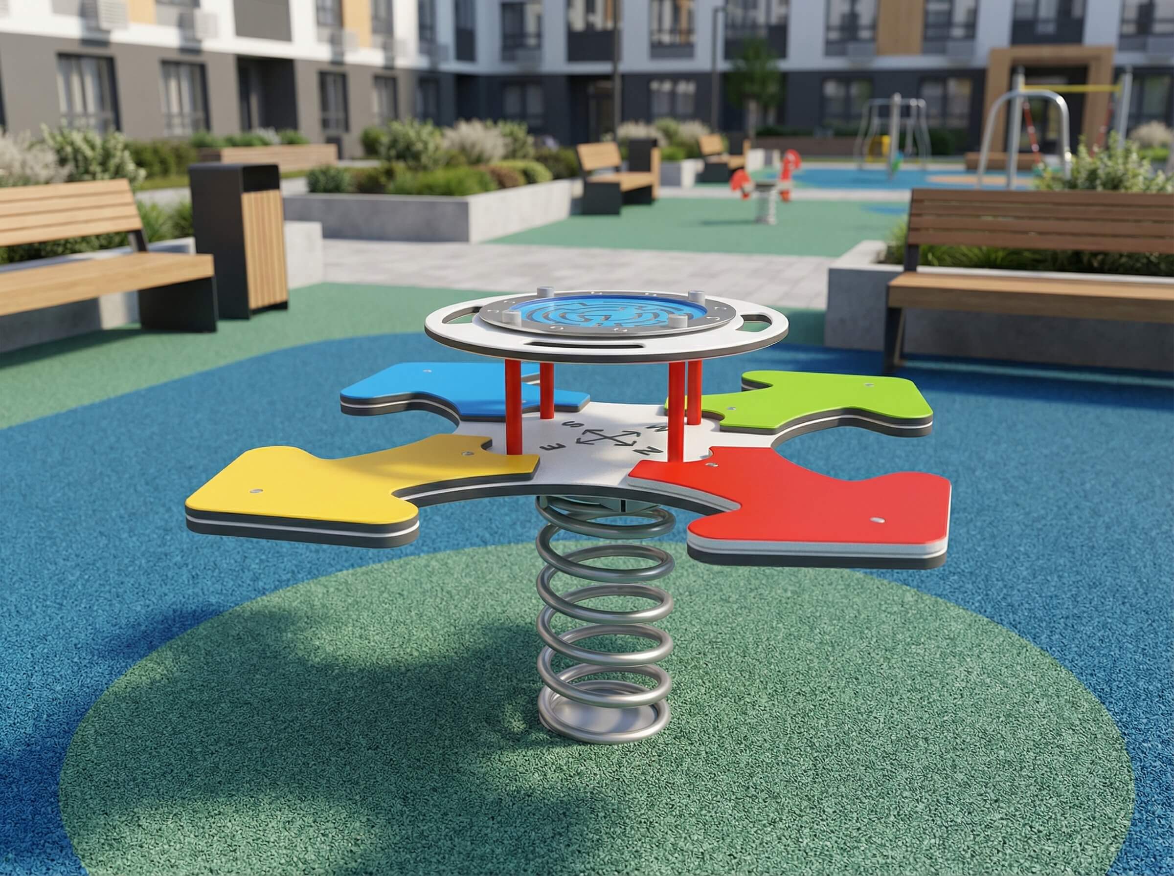 Bunte Springturm-Spielanlage auf grünem Kunstrasen im modernen Spielplatz vor Wohnhäusern.