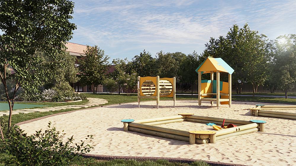 Spielplatz mit Sandkasten und Klettergerüst im sonnigen Parkgelände.